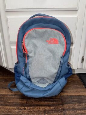The North Face Blue and Gray Backpack with Coral Trim